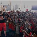 Randy showing the kids how to shoot a basketball